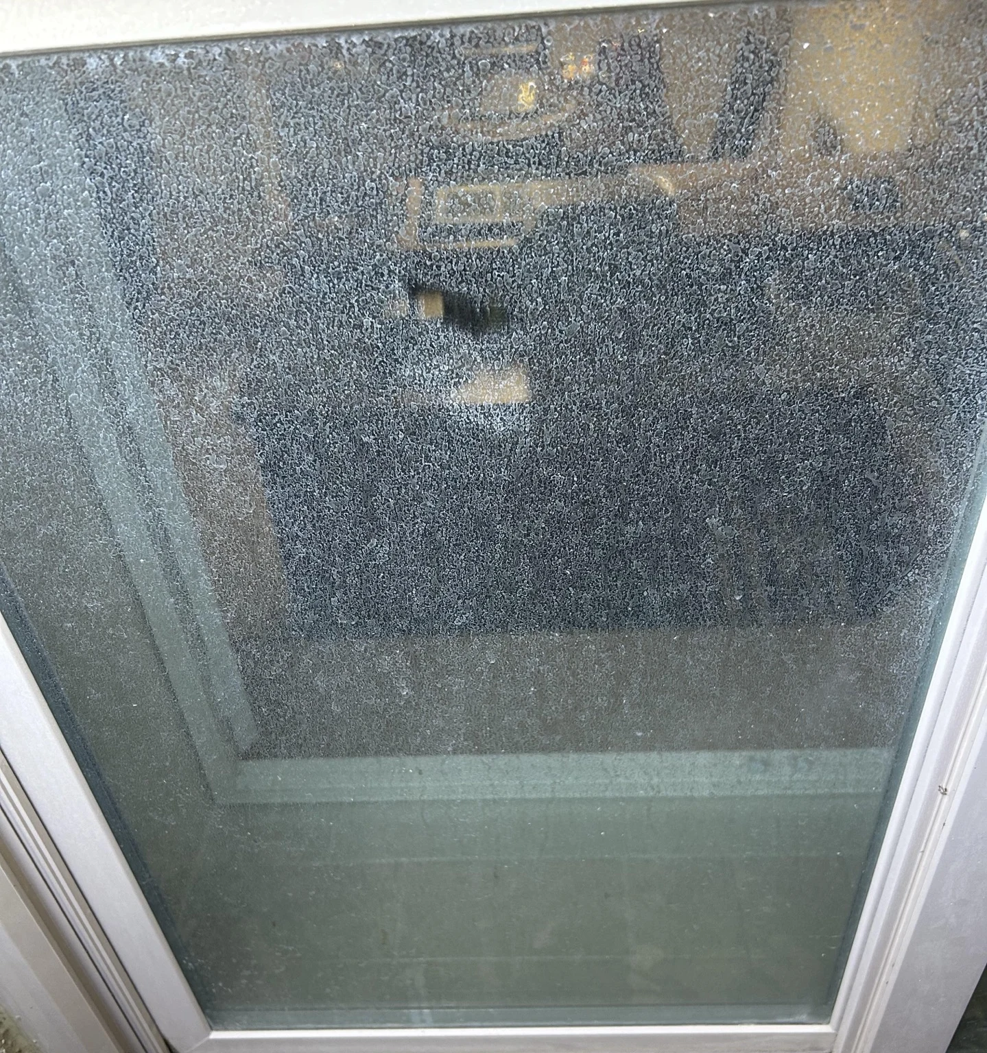 The window before cleaning, with visible mineral buildup